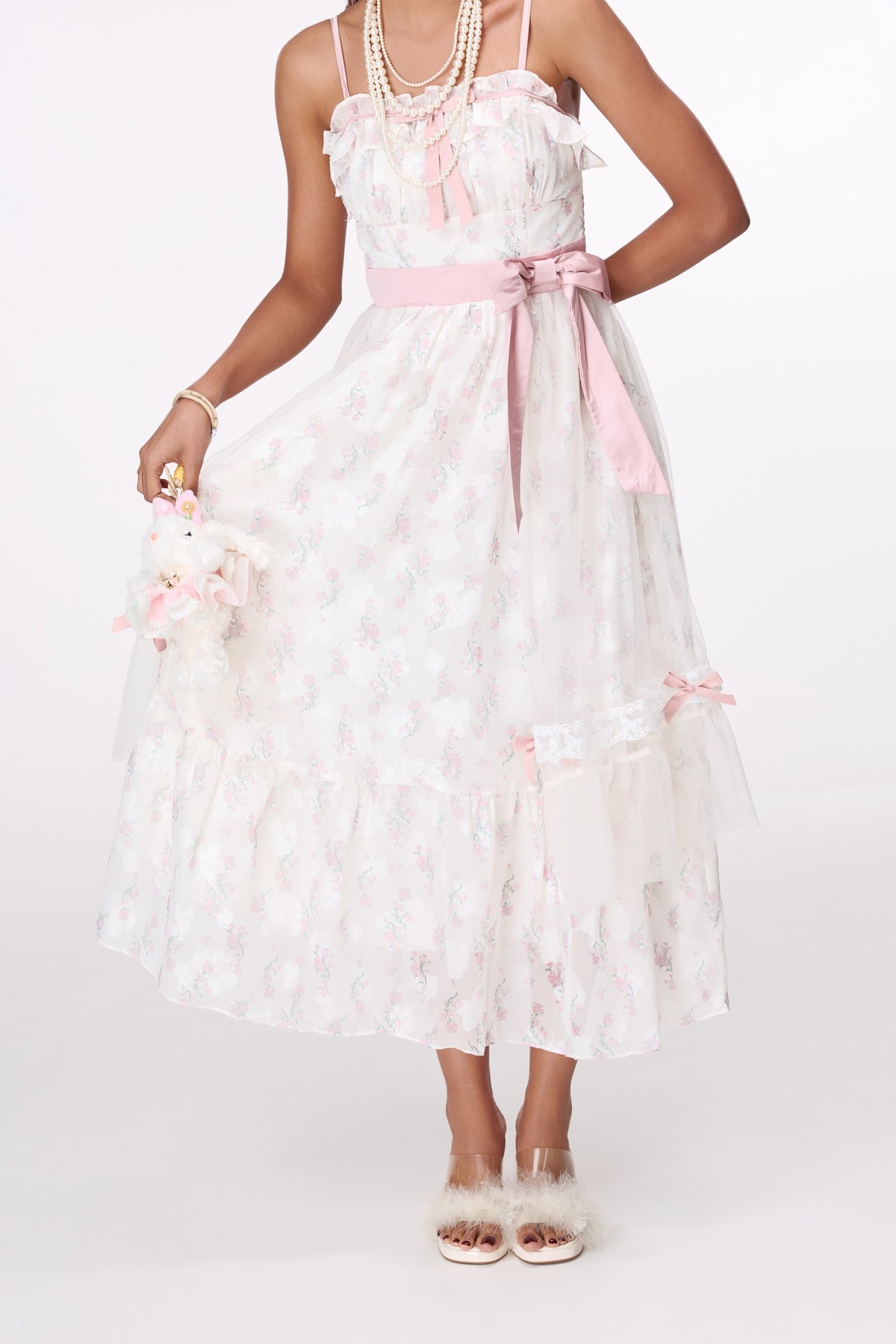 Pink Dress-Up Plush Charm by STAGEE, worn on model